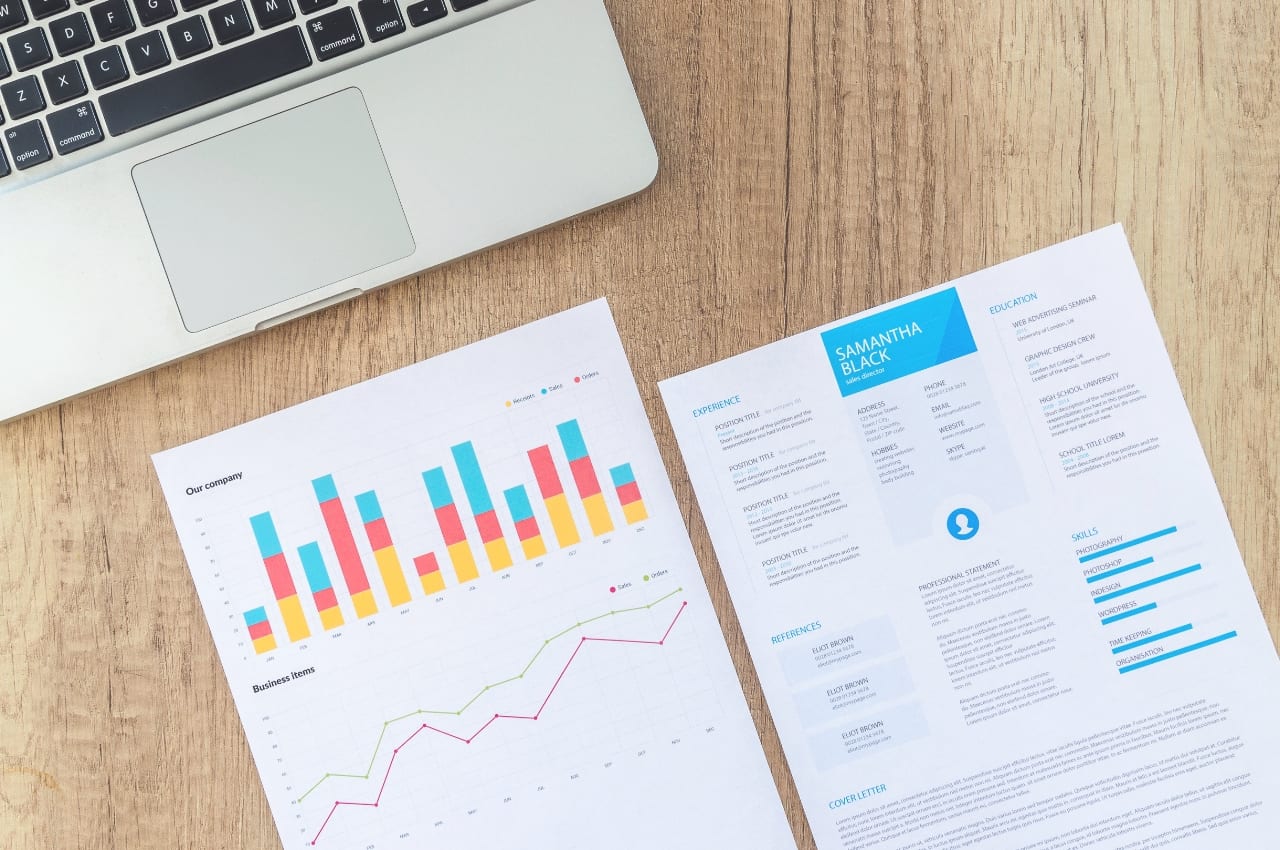examples of interactive powerpoint presentations Two handouts next to laptop