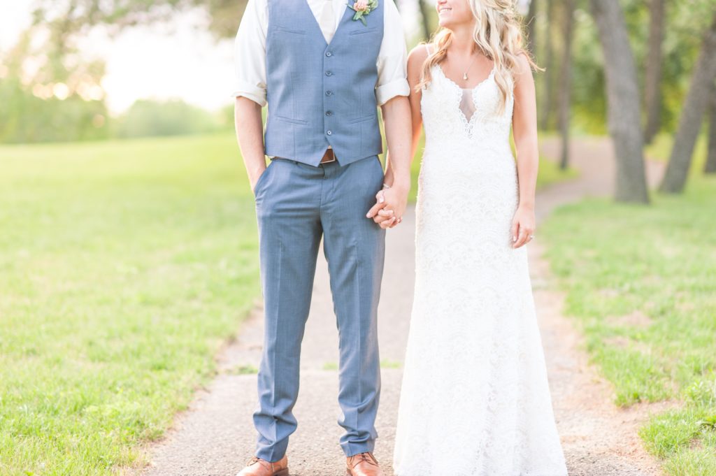 Bride-and-groom-holding-hands-during-the-wedding-day